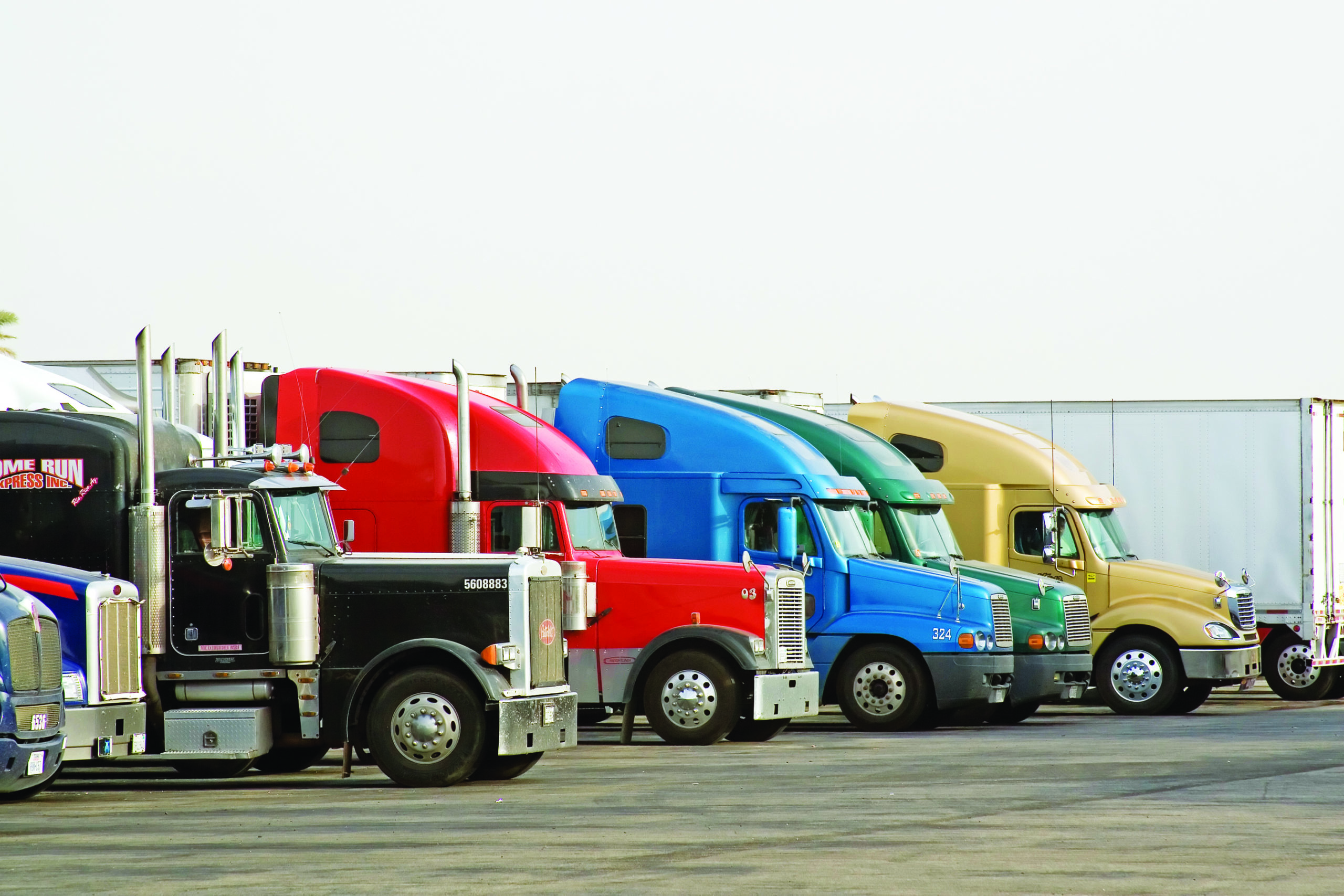 Multi-colored trucks staggered in a line
