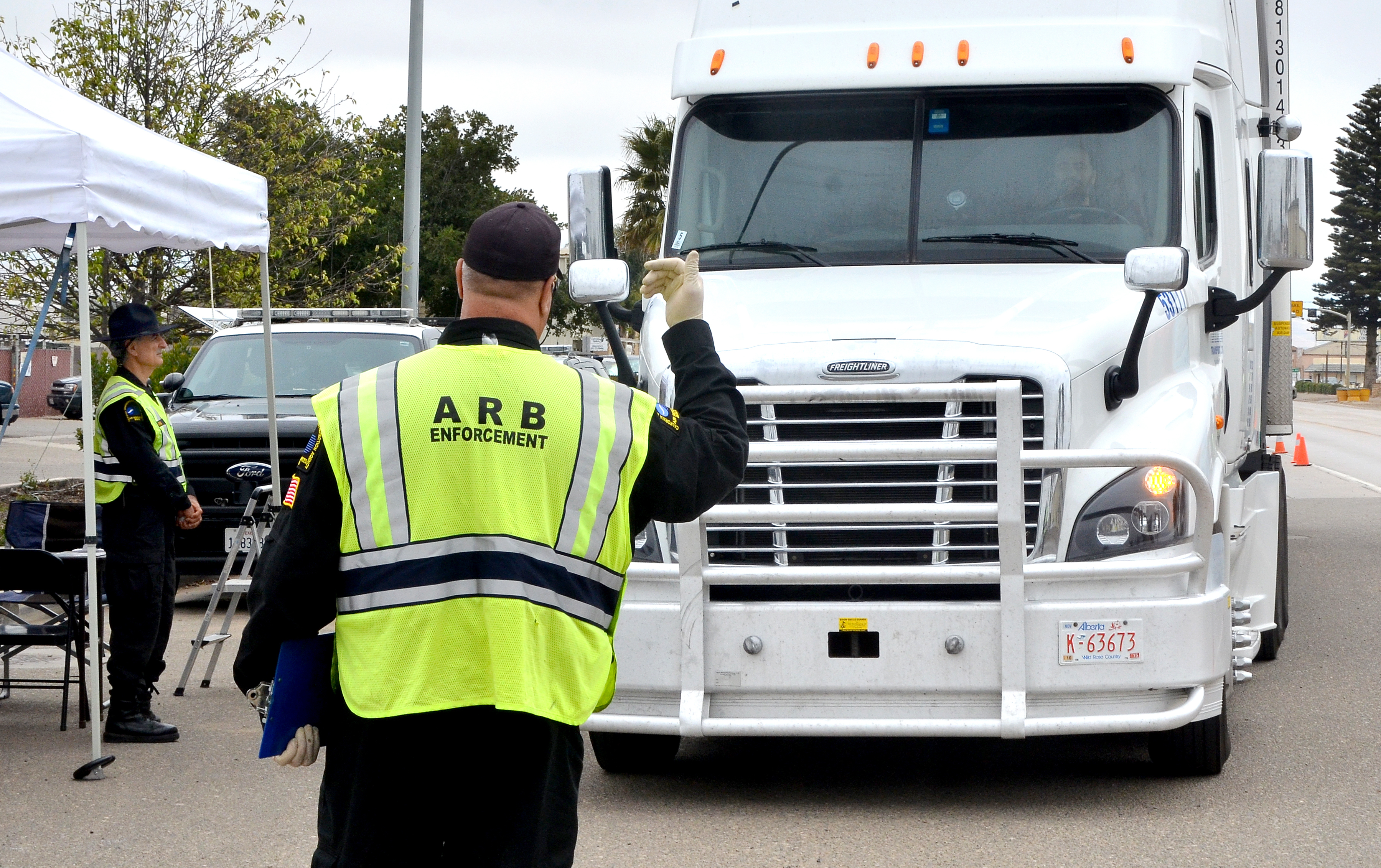 ARB official in front of a truck